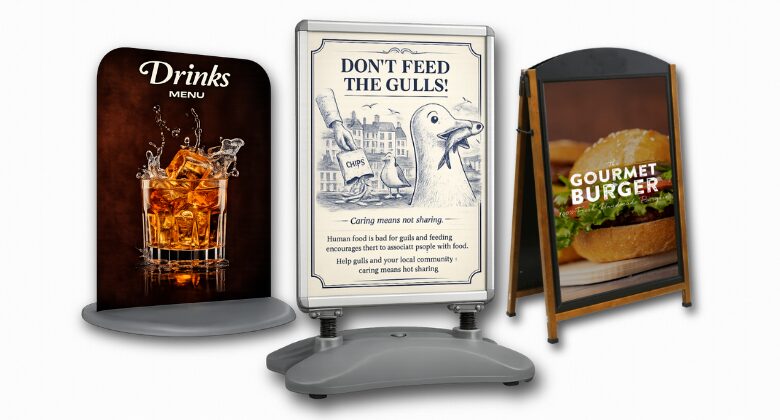 Printed A-boards and swinging forecourt signs on a seafront pavement